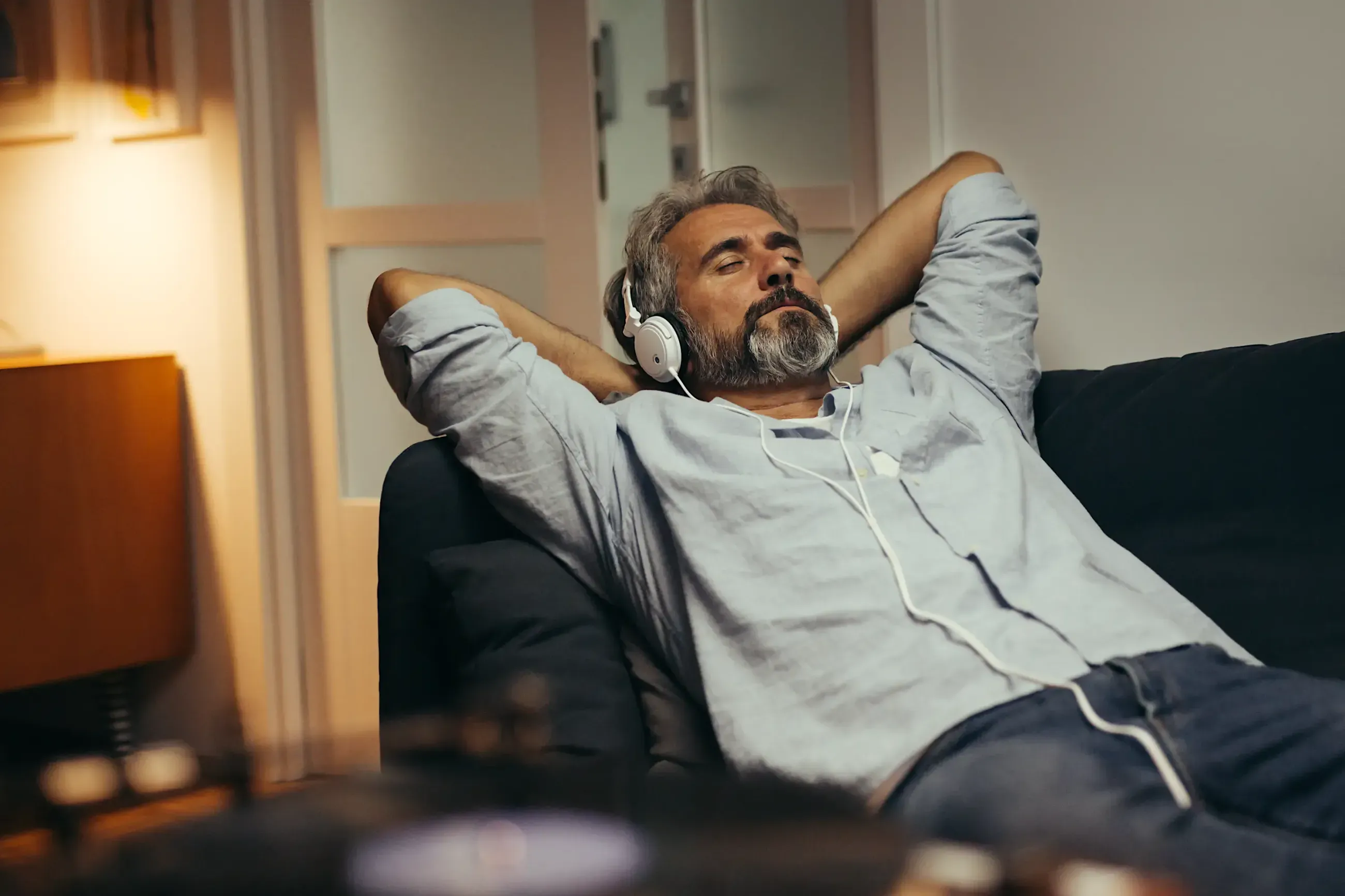 A man at peace, eyes closed, listening — present in the moment